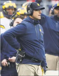  ?? Jay LaPrete / Associated Press ?? Michigan coach Jim Harbaugh says he’s staying put with the Wolverines and not seeking an NFL coaching job.