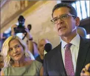  ?? Dennis M. Rivera Pichardo Associated Press ?? PEDRO PIERLUISI, with spokeswoma­n and sister Caridad Pierluisi, faces legal challenges for the office.