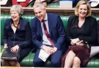  ?? Agence France-presse ?? Theresa May, Brexit Minister Stephen Barclay (centre) and Britain’s Work and Pensions Secretary Amber Rudd react during the weekly question and answer session, in the House of Commons in London on Wednesday.