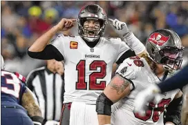  ?? STEVEN SENNE/ASSOCIATED PRESS ?? Tampa Bay Buccaneers quarterbac­k Tom Brady calls out a play at the line of scrimmage Sunday night during the second half of his game against the New England Patriots, his former team, in Foxborough, Mass.