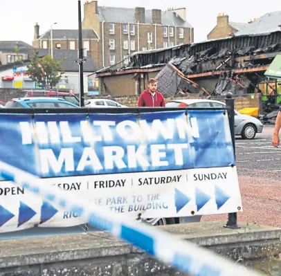  ?? Picture: Mhairi Edwards. ?? Devastatio­n: the scene of the Hilltown blaze.