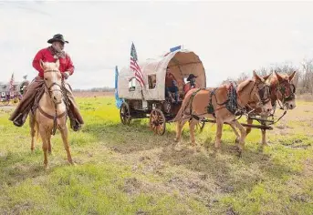  ?? Elizabeth Conley/Staff photograph­er ?? Northeaste­rn Trail Riders trail boss Anthony Bruno leads his riders, one of four Black trail riding groups participat­ing in this year’s Houston Livestock Show and Rodeo.