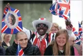  ??  ?? Well wishers wait for the royal family to arrive at St Paul’s in London.