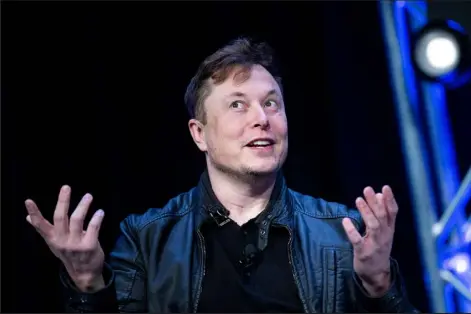  ?? Brendan Smialowski / Getty Images ?? Elon Musk said on Friday he was putting a temporary halt on his much-anticipate­d deal to buy Twitter, sending shares in the social media giant plunging.