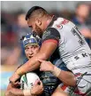  ?? GETTY IMAGES ?? Sam Lisone tackles Johnathan Thurston last night.