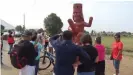  ?? ?? The roadside monument has drawn tourists, as the statue stands on the route between the adobe temples of the sun and the moon. Photograph: AP