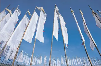  ??  ?? Prayer flags kissing the sky and dancing in the breeze