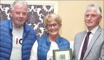  ??  ?? Declan and Roseleen McKeown accept their award from Hugh Callaghan.