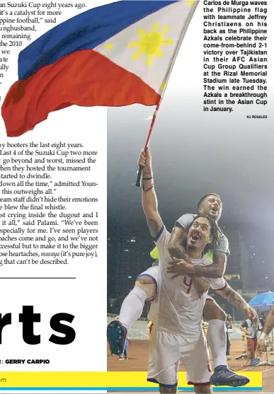  ?? KJ ROSALES ?? Carlos de Murga waves the Philippine flag with teammate Jeffrey Christiaen­s on his back as the Philippine Azkals celebrate their come-from-behind 2-1 victory over Tajikistan in their AFC Asian Cup Group Qualifiers at the Rizal Memorial Stadium late...