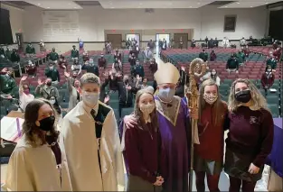  ?? SUBMITTED PHOTO ?? Students of the Archbishop Prendergas­t & Monsignor Bonner High School Ministry Team, left to right, Riley Philson, James Higgins, Lauren Nestor, Erin Rugh, and Rachel Scheb, talk with Archbishop Nelson Pérez, following Mass last week in the school’s auditorium.