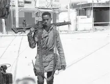  ?? Farah Abdi Warsameh/Associated Press ?? A soldier patrols near the Hayat Hotel in Mogadishu, Somalia, Islamic militants stormed the hotel Friday, police said.