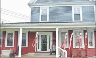  ?? SHARON MONTGOMERY-DUPE/CAPE BRETON POST ?? This house at 734 Main Street Glace Bay is decorated in a lovely way for Canada 150 during the day with flags and red and white tulips preparing to open.