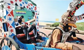  ?? News Agency (ANA) | SHELLEY KJONSTAD African ?? RICKSHAW operator Simon Sibiya gives ethekwini Mayor Mxolisi Kaunda a ride at the Durban beachfront.