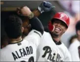  ?? DERIK HAMILTON — THE ASSOCIATED PRESS ?? Phillies’ pinch-hit extraordin­aire Nick Williams, right, celebrates with catcher Jorge Alfaro after Williams hit a solo home run in the eighth inning Saturday that boosted the Phillies to a win over the Toronto Blue Jays.