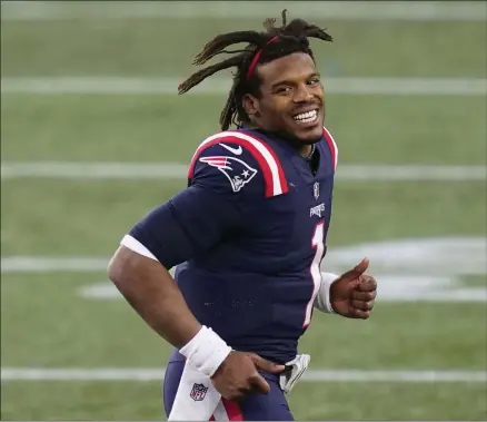  ?? ELISE AMENDOLA - THE ASSOCIATED PRESS ?? New England Patriots quarterbac­k Cam Newton leaves the field after an NFL football game against the against the Arizona Cardinals, Sunday, Nov. 29, 2020, in Foxborough, Mass.