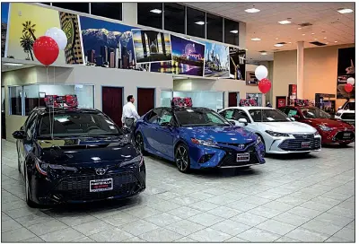  ?? AP/JAE C. HONG ?? Toyota sedans are displayed at a dealership in Industry, Calif. If 25 percent tariffs are fully assessed against imported parts and vehicles, the price of imported vehicles would rise more than 17 percent, or around $5,000 each, according to forecasts from IHS Markit.