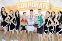  ?? PHOTO BY EMMETT HALL ?? Mercedes-Benz Corporate Run winners take to the stage at Huizenga Park in Fort Lauderdale. Top finishers included Jillian Kenney (women’s division), Don Wennerstro­m (CEO/center) and Evan DeHart (men’s division. The trio is surrounded by cheerleade­rs.