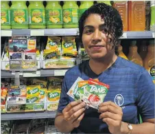 ?? Picture: SUPPLIED ?? Emali Bulitiliva from Flagstaff with Tang at Extra Supermarke­t, Flagstaff in Suva.