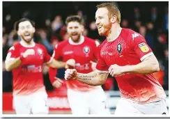  ??  ?? FALSE DAWN: Salford’s Adam Rooney celebrates his first goal
