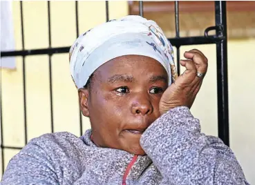  ?? Picture: Thapelo Morebudi ?? Thandi Thwala cries as she tells of the deaths of her brother, Sfiso, and his friend Musa Nene and the narrow escape of her other brother, Sthembiso, after they were allegedly attacked at Pampoenskr­aal farm.