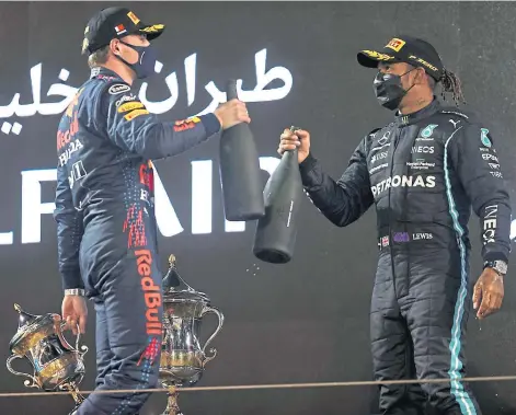  ??  ?? THE RACE IS ON: Lewis Hamilton got the better of rival Max Verstappen at the season opener in Bahrain.