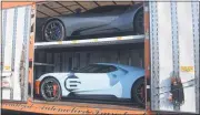  ??  ?? The 2020GT Ford Heritage Edition supercar, which was delivered to Krapohl Ford & Lincoln on Friday being unloaded from the delivery truck.