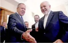  ??  ?? Lavrov invites Zarif to have a seat during their meeting in Moscow. — Reuters photo