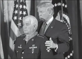  ?? AP/PABLO MARTINEZ MONSIVAIS ?? President Donald Trump bestows the nation’s highest military honor on former Army medic James McCloughan on Monday at the White House.