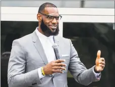  ?? Phil Long / Associated Press ?? LeBron James speaks at the July 30 opening ceremony for the I Promise School in Akron, Ohio.