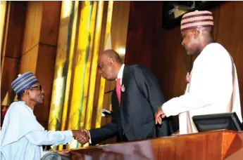  ??  ?? President Muhammadu Buhari (L) in a handshake with Senate President Bukola Saraki, while House of Representa­tives Speaker Yakubu Dogara looks on