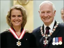  ?? THE CANADIAN PRESS FILE PHOTO ?? Astronaut Julie Payette stands with Governor General David Johnston after she was invested into the Order of Canada in 2011.