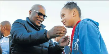  ?? Picture: MICHAEL PINYANA ?? REWARDING TIME: Linique Trimalley receives a medal from BCM mayor Xola Pakati for her outstandin­g performanc­e during the Mayor’s Cup one-day tournament organised by Pakati’s office to commemorat­e Youth Day