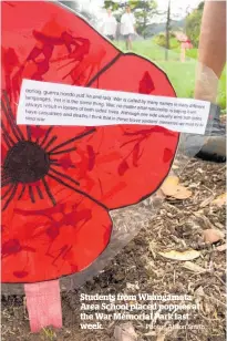  ?? Photo / Alison Smith ?? Students from Whangamata Area School placed poppies at the War Memorial Park last week.