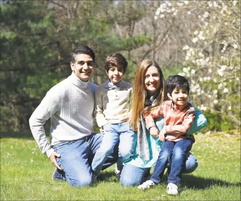  ?? Tyler Sizemore / Hearst Connecticu­t Media ?? Mireia and Sagar Manilal with their children, Alex, 5, and Nikhil, 7, at their home in backcountr­y Greenwich on April 16. The Manilals and several other families are disappoint­ed that Parkway School pre-K is closing this fall to make way for a new class opening up at North Street School.