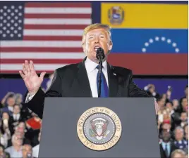  ?? Andrew Harnik The Associated Press ?? President Donald Trump speaks Monday to a Venezuelan American community at Florida Ocean Bank Convocatio­n Center in Miami, Fla.