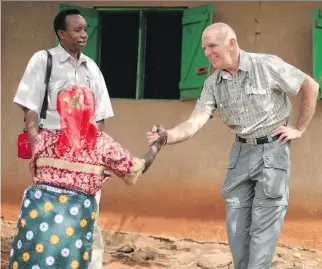  ??  ?? Dr. Don Kilby, right, has been recognized for his work with the non-profit Canada-Africa Community Health Alliance, which seeks to improve health and access to care in underserve­d rural African communitie­s.