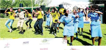  ??  ?? Flairy’s in the air at St Catherine High School as students join Youth Reaching Youth and Mr Chicken on the lawn.