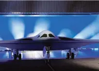  ?? MARCIO JOSE SANCHEZ/ASSOCIATED PRESS ?? The B-21 Raider stealth bomber is unveiled Friday at Northrop Grumman in Palmdale, Calif. America’s newest nuclear stealth bomber made its debut after years of secret developmen­t.