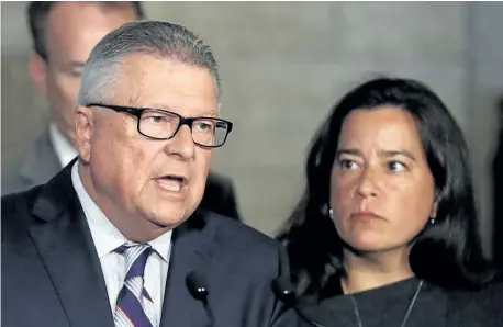  ?? FRED CHARTRAND/ THE CANADIAN PRESS ?? Public Safety Minister Ralph Goodale and Justice Minister Jody Wilson-Raybould hold a news conference Friday on Parliament Hill in Ottawa regarding a $10.5-millon payment to Omar Khadr. The federal government has formally apologized to former...