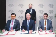  ?? ?? The MoU was jointly signed by Dr Thani Bin Ahmad Al Zeyoudi, UAE Minister of State for Foreign Trade, and Mohammad Ali Al Shorafa, Chairman of the Abu Dhabi Department of Economic Developmen­t, and Klaus Schwab, Founder and Executive Chairman, World Economic Forum.