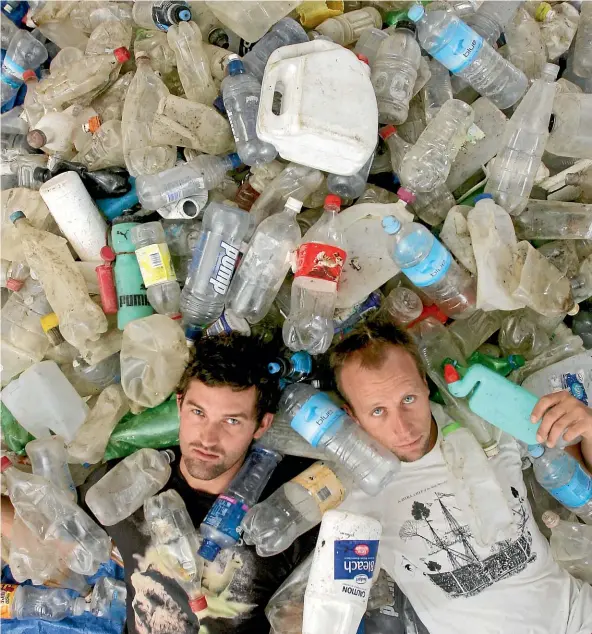 ?? JASON OXENHAM/STUFF ?? Sustainabl­e Coastlines’ Camden Howitt, left, and Sam Judd with just some of the plastic bottles collected from the Rangitoto foreshore.
