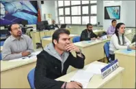  ?? PROVIDED TO CHINA DAILY ?? Edgar Moreno Pena (front), a space industrial engineer from Venezuela, attends a course with fellow students at the Shenzhou Institute in Beijing.