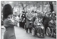  ?? AP/RICK FINDLER ?? People at the Cenotaph war memorial in London take part in the Western Front Associatio­n’s annual service of remembranc­e Saturday, one of numerous events across Europe marking the anniversar­y of the end of World War I.