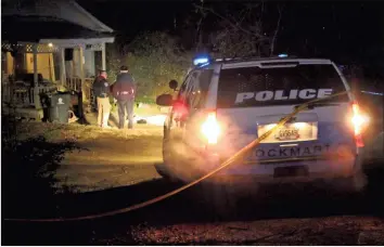  ??  ?? Two of four bodies were found outside of a house in an alleyway between West Church Street and Martin Luther King Jr. Street in Rockmart on Thursday evening, January 24, 2019