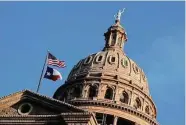  ?? Eric Gay/Associated Press ?? Flags fly over the Texas Capitol during the first day of the legislativ­e session earlier this month in Austin.