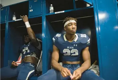  ?? COURTESY OF TYSON TRISH/BLAIR ACADEMY ?? David Ojabo, left, and Odafe Oweh sit at their lockers during a Blair Academy football game in 2017. Five years later, Ojabo and Oweh, who formed a bond in high school over their Nigerian roots, have reunited with the Ravens.