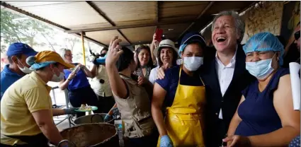  ??  ?? Organizati­on of American States Secretary-General Luis Almagro greets Venezuelan migrants at the “Divina Providenci­a” migrant shelter, in La Parada, Colombia, on Friday.AP Photo/FernAndo VergArA