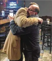  ?? OFFICE OF TIM RYAN ?? U.S. Rep. Tim Ryan (left) hugs Youngstown businessma­n Amer Othman Adi on Thursday upon learning that immigratio­n officials canceled his Sunday deportatio­n while his case is re-examined.