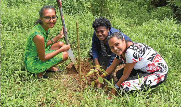  ?? Photo: Fiji National University ?? Fiji National University staff and students planting seedlings.