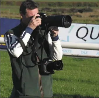  ??  ?? Pat Healy busy at work on the racecourse.